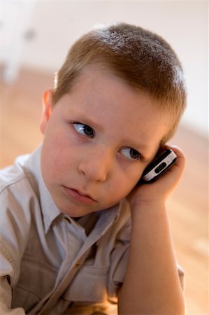 fabthi (artist) - Child with a mobile phone listening with a funny expression Stock Photo - Budget Royalty-Free & Subscription, Code: 400-04457083