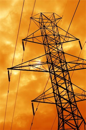 simsearch:400-04838002,k - The silhouette of a power line tower against an ominous orange sky. Foto de stock - Royalty-Free Super Valor e Assinatura, Número: 400-04457210
