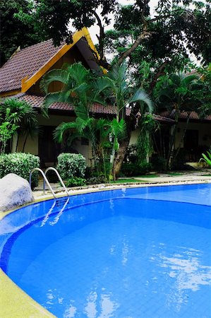 simsearch:400-03961189,k - Swimming pool area at a tropical Asian resort - travel and tourism. Fotografie stock - Microstock e Abbonamento, Codice: 400-04457373