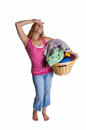 A beautiful young lady overwhelmed by too much laundry Stock Photo - Budget Royalty-Free & Subscription, Code: 400-04457670