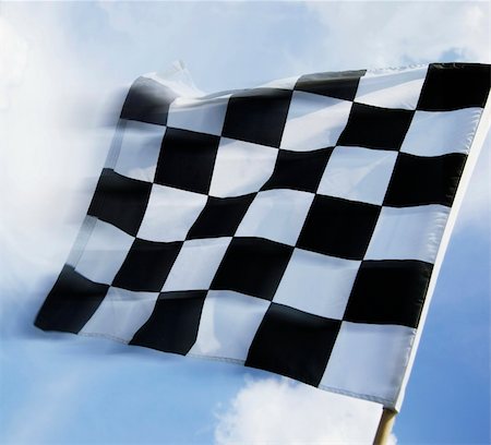 simsearch:400-04543406,k - Checkered flag waving against a blue sky Foto de stock - Royalty-Free Super Valor e Assinatura, Número: 400-04458137
