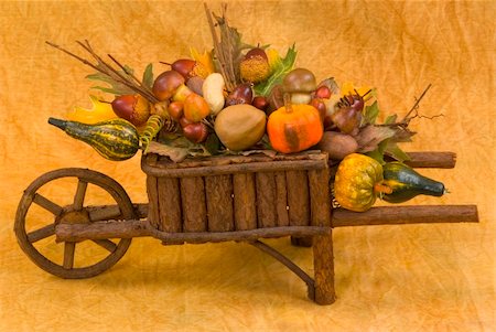 Wooden wheelbarrow filled with fall's harvest Stock Photo - Budget Royalty-Free & Subscription, Code: 400-04458419