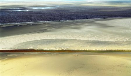 Aerial view of Atlantic ocean at low tide near Mont Saint Michel abbey in France. Background. Stock Photo - Budget Royalty-Free & Subscription, Code: 400-04458652