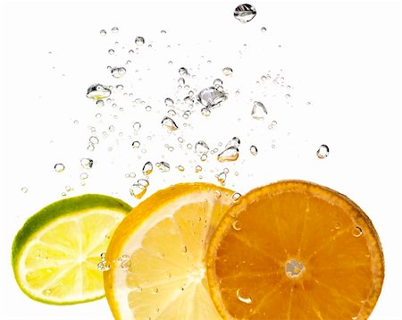 simsearch:400-03931888,k - Splash slice of citrus to water Stock Photo - Budget Royalty-Free & Subscription, Code: 400-04459090