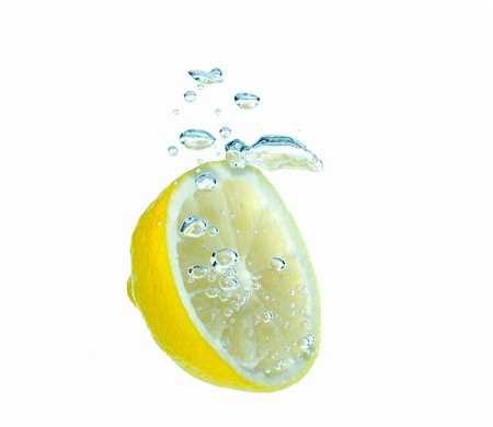 simsearch:400-03931888,k - Splash slice of citrus to water Stock Photo - Budget Royalty-Free & Subscription, Code: 400-04459091