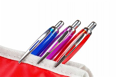 simsearch:400-09186322,k - Three pens in a red pencil case over a white background Photographie de stock - Aubaine LD & Abonnement, Code: 400-04459222