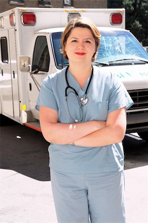 Female doctor or paramedic in front of an ambulance Stock Photo - Budget Royalty-Free & Subscription, Code: 400-04459808