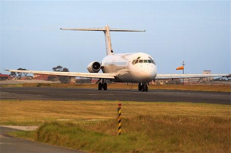 A passenger jetliner on the runway before take off Fotografie stock - Microstock e Abbonamento, Codice: 400-04459874