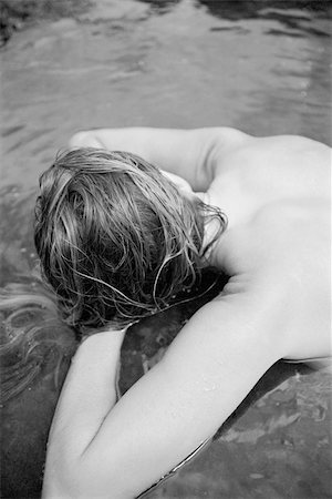 simsearch:400-04427380,k - Above view of sexy partially nude Caucasian woman lying in tidal pool in Maui, Hawaii. Photographie de stock - Aubaine LD & Abonnement, Code: 400-04450397