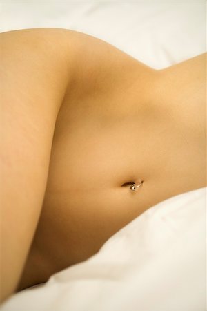 Nude Caucasian female body with pierced belly button. Stock Photo - Budget Royalty-Free & Subscription, Code: 400-04450485