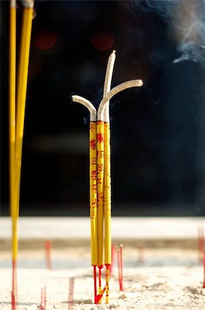 Several incense sticks buring and holding in the incense holder Stock Photo - Budget Royalty-Free & Subscription, Code: 400-04450595