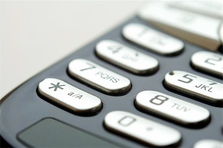 simsearch:400-03992117,k - A close up shot of mobile keypad under light Stock Photo - Budget Royalty-Free & Subscription, Code: 400-04450599