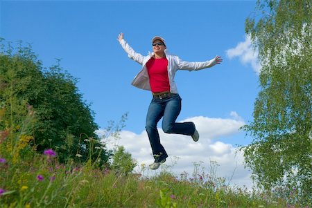 simsearch:400-04215852,k - Beautiful lady jumping in summer landscape Stock Photo - Budget Royalty-Free & Subscription, Code: 400-04450644