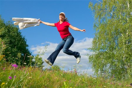 simsearch:400-04215852,k - Beautiful lady jumping in summer landscape Stock Photo - Budget Royalty-Free & Subscription, Code: 400-04450645