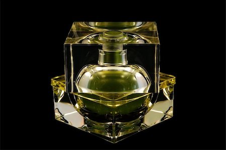 simsearch:700-06892568,k - An isolated perfume bottle over black background Stock Photo - Budget Royalty-Free & Subscription, Code: 400-04450640
