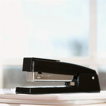simsearch:400-03926032,k - Black stapler with window in background. Stock Photo - Budget Royalty-Free & Subscription, Code: 400-04451873
