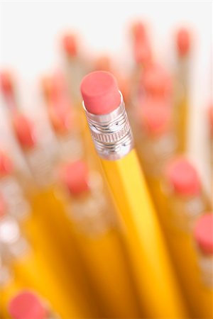simsearch:400-04451935,k - Group of eraser ends of pencils with one standing out higher than the rest. Fotografie stock - Microstock e Abbonamento, Codice: 400-04451921
