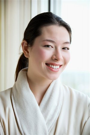 simsearch:400-03926201,k - Taiwanese mid adult woman in bathrobe smiling at viewer. Fotografie stock - Microstock e Abbonamento, Codice: 400-04451986