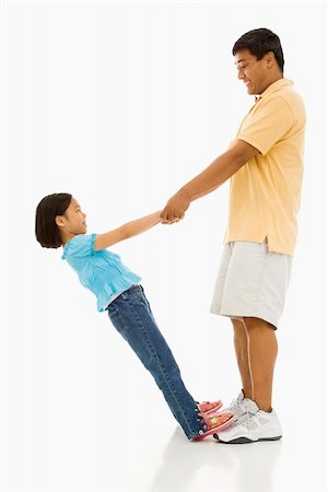 filipino family portrait - Asian daughter standing on father's feet holding his hands and leaning back. Stock Photo - Budget Royalty-Free & Subscription, Code: 400-04452272