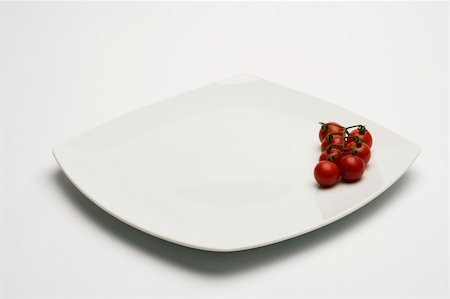 restaurant washing dishes - Tomatos in white plate over white Stock Photo - Budget Royalty-Free & Subscription, Code: 400-04452554