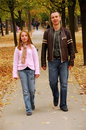 family with teenagers city park - Father and daughter taking a walk in an autumn park Stock Photo - Budget Royalty-Free & Subscription, Code: 400-04452737