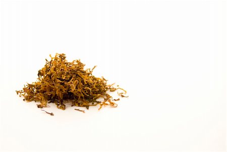 A little pile of rolling tobacco for making home made cigarettes Stock Photo - Budget Royalty-Free & Subscription, Code: 400-04452816