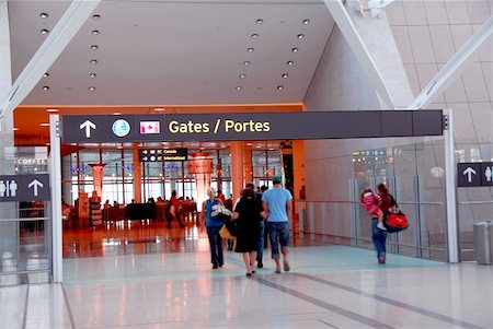 simsearch:400-03915225,k - People walking towards gates at modern internation airport Stock Photo - Budget Royalty-Free & Subscription, Code: 400-04453083