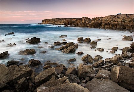 simsearch:400-03925229,k - Picture of the sunset with beautiful rocks on the ocean Stock Photo - Budget Royalty-Free & Subscription, Code: 400-04453173