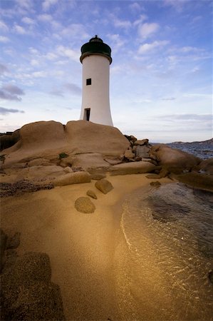 simsearch:400-04900592,k - lighthouse seen from a tiny beach in Sardinia. Photographie de stock - Aubaine LD & Abonnement, Code: 400-04453307