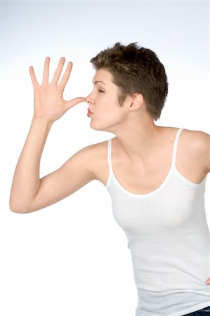 Female shows big fool nose gesture Fotografie stock - Microstock e Abbonamento, Codice: 400-04453430