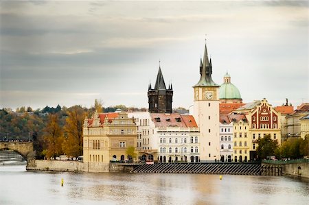 simsearch:400-07620236,k - The old town bridge and tower in the background behind some buildings in old town Prague Stock Photo - Budget Royalty-Free & Subscription, Code: 400-04464051