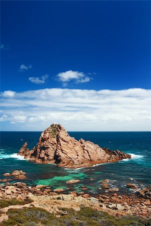 Photo of Sugarloaf Rock between Cape Leeuwin and Cape Naturaliste in south-west Western Australia, on a sunny day with a few clouds in the distance. Stock Photo - Budget Royalty-Free & Subscription, Code: 400-04464808