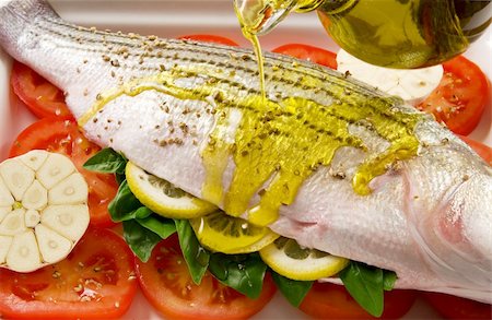 striped tomato - Striped sea bass; preparing fish for cooking Stock Photo - Budget Royalty-Free & Subscription, Code: 400-04465027