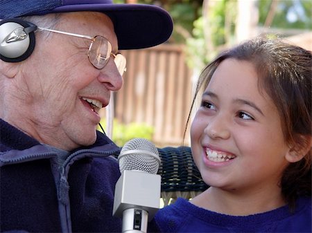 elderly person singing - Grandfather and granddaughter singing together Stock Photo - Budget Royalty-Free & Subscription, Code: 400-04465082