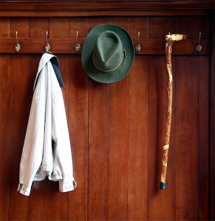 Still life od a wooden clothes rack with a hat,jacket and a cane Foto de stock - Super Valor sin royalties y Suscripción, Código: 400-04465131