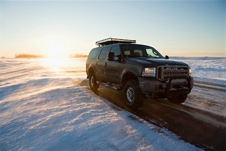 simsearch:400-03944669,k - Truck on icy road with snowy landscape. Photographie de stock - Aubaine LD & Abonnement, Code: 400-04465274