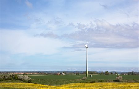 denmark environmental problems - Windmill on a flat landsacpe capturing engergy against a blue sky Stock Photo - Budget Royalty-Free & Subscription, Code: 400-04465409
