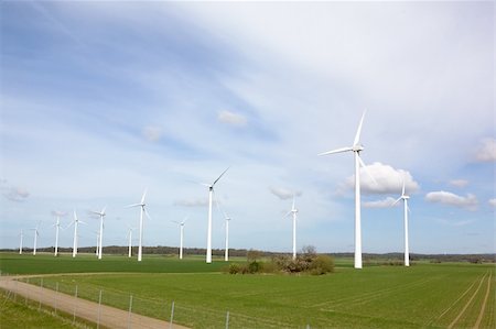 denmark environmental problems - Windmill on a flat landsacpe capturing engergy against a blue sky Stock Photo - Budget Royalty-Free & Subscription, Code: 400-04465410
