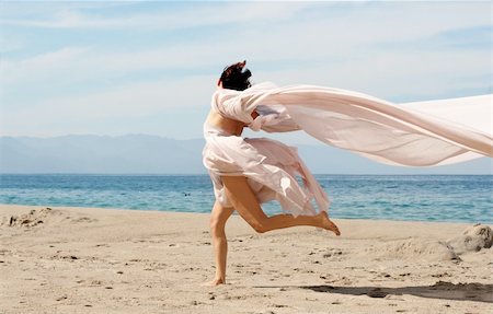 Woman running on the beach Stock Photo - Budget Royalty-Free & Subscription, Code: 400-04465528
