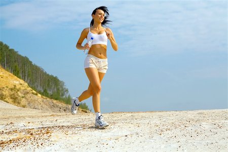 simsearch:400-05025032,k - woman running on sand Stock Photo - Budget Royalty-Free & Subscription, Code: 400-04465592
