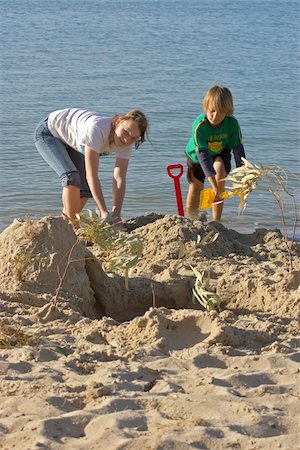 children playing and building sancastles on the beach Stock Photo - Budget Royalty-Free & Subscription, Code: 400-04465903