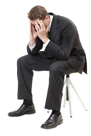 simsearch:400-05363701,k - Depressed businessman sitting face in hands Stock Photo - Budget Royalty-Free & Subscription, Code: 400-04466199