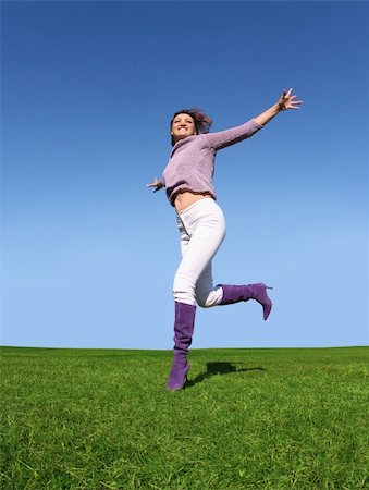 simsearch:400-06077546,k - Happy woman running on grass Stockbilder - Microstock & Abonnement, Bildnummer: 400-04466506