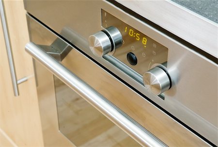 simsearch:400-05134463,k - A modern stainless steel oven detail showing the knobs and door Stock Photo - Budget Royalty-Free & Subscription, Code: 400-04466566