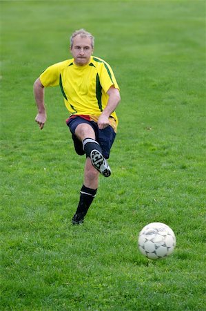Soccer player hitting a ball Stock Photo - Budget Royalty-Free & Subscription, Code: 400-04466799
