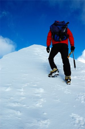 A lonely climber reaching the summit of the mountain Stock Photo - Budget Royalty-Free & Subscription, Code: 400-04466849