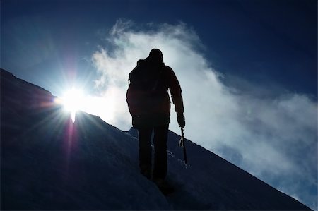 A lonely climber reaching the summit of the mountain Stock Photo - Budget Royalty-Free & Subscription, Code: 400-04466851
