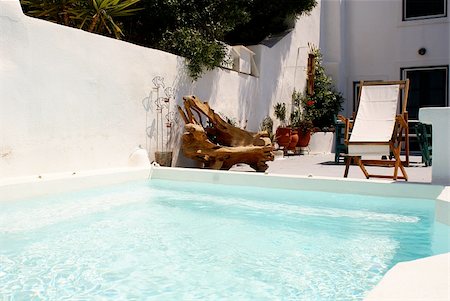Pool and a special wooden from olive tree chair Photographie de stock - Aubaine LD & Abonnement, Code: 400-04467014