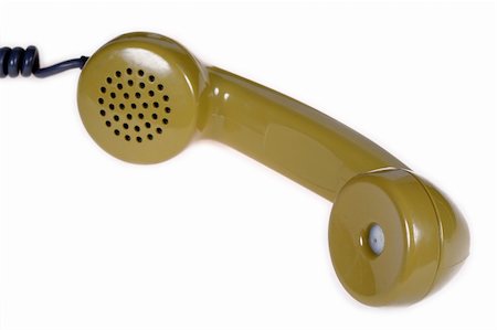 simsearch:400-04493639,k - Green old telephone reciver on wite background.  The focus is on the speaker and not on the microphone. Foto de stock - Super Valor sin royalties y Suscripción, Código: 400-04467083