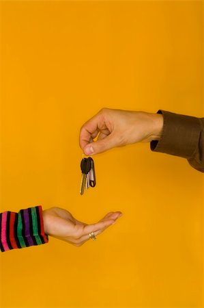 a business man passing the keys to a young woman Stock Photo - Budget Royalty-Free & Subscription, Code: 400-04467526